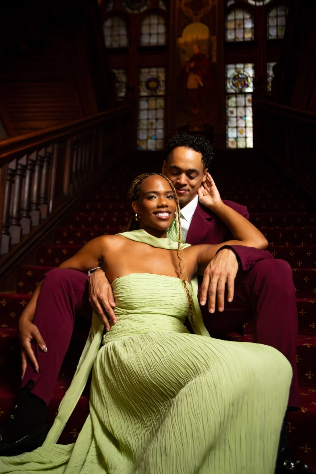 Alexis and Gary together on the elegant staircase